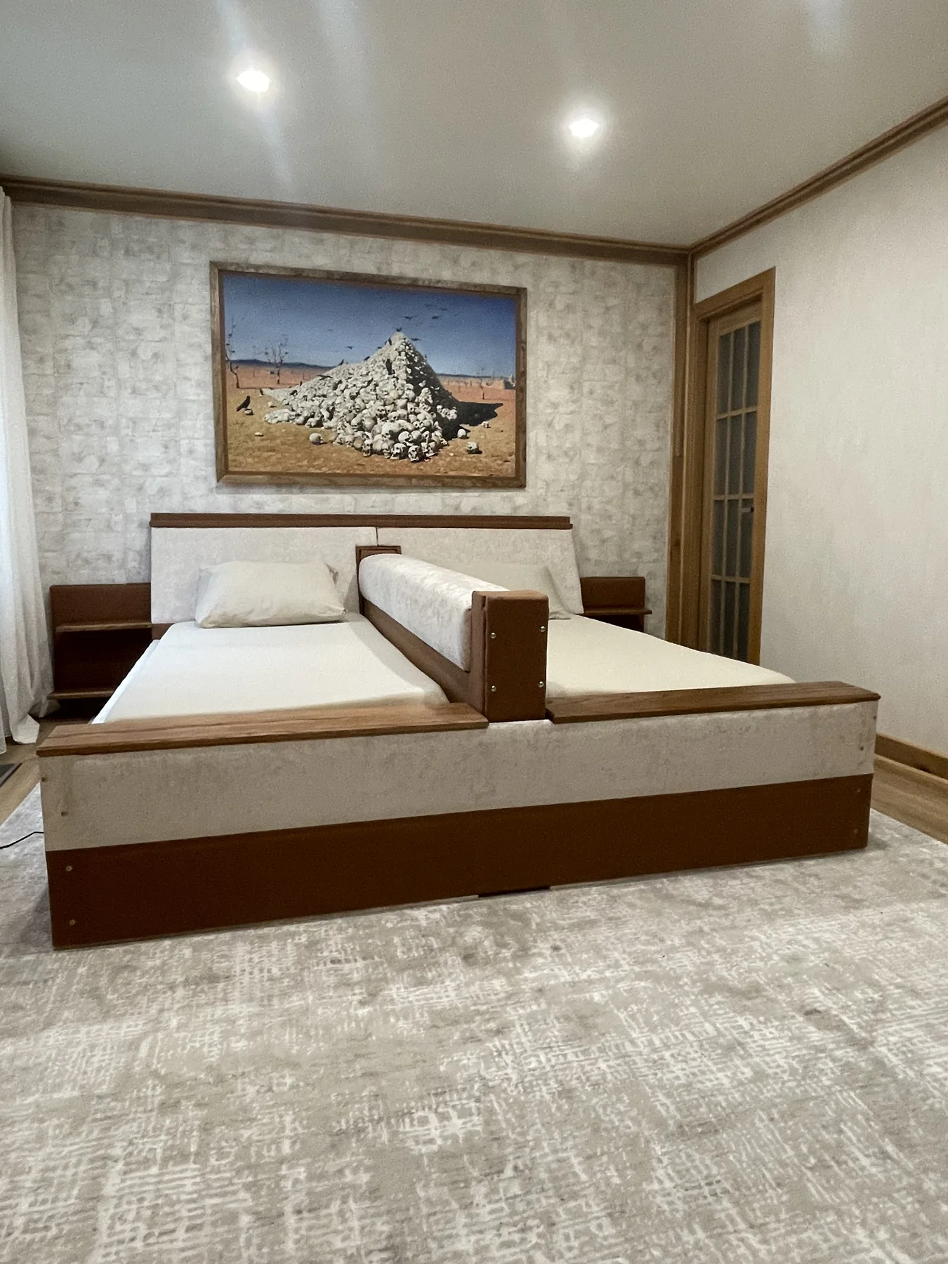 Bed with a Motorized Retractable Center Divider